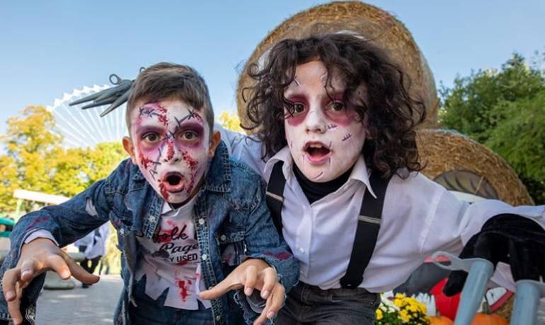 Children dressed as zombies in a theme park.